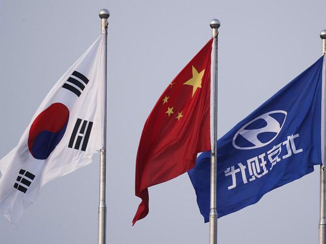 Giới chức Trung - Hàn mới đây nhất trí cùng thảo luận để gạt bỏ bất đồng ảnh hưởng đến thương mại giữa hai nước  /// Ảnh: Reuters