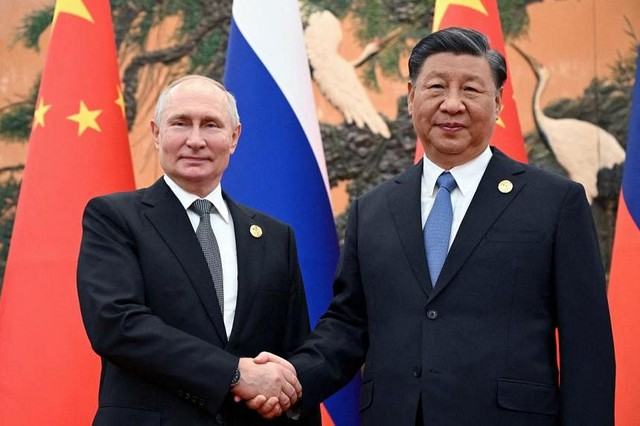 Tổng thống Nga Vladimir Putin và Chủ tịch Trung Quốc Tập Cận Bình. Ảnh: Reuters