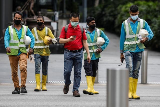 Kể từ ngày 1-12, người lao động ở Singapore có thể yêu cầu được làm việc 4 ngày mỗi tuần  Ảnh: REUTERS